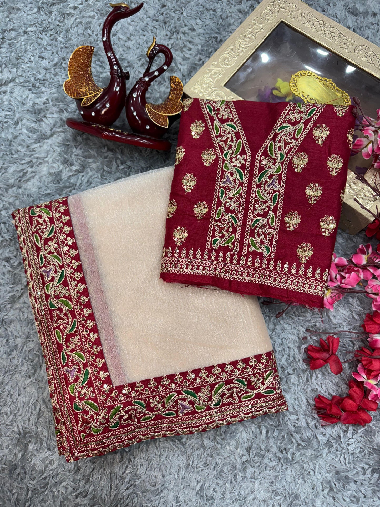 😍Unveil your inner fashionista with our stunning muted Champaign gold designer saree paired with the most sought-after Embroidery blouse in rich red.