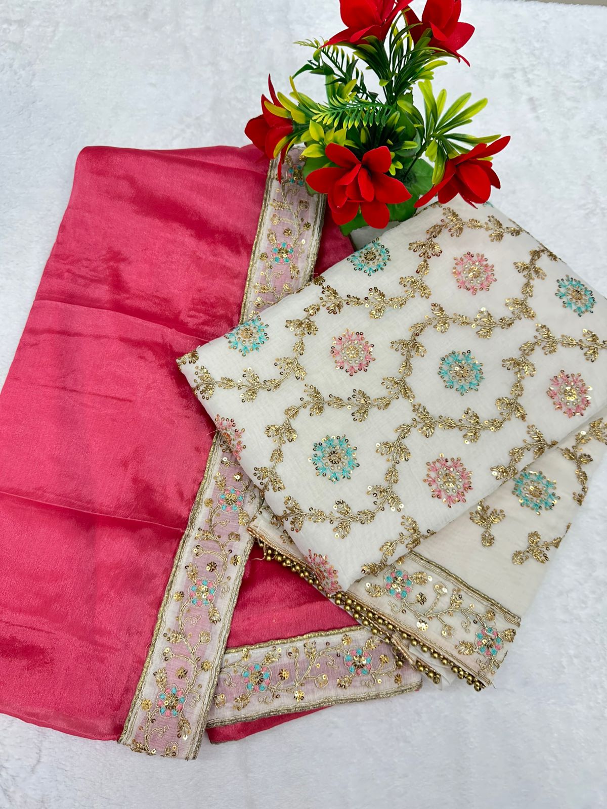 Elevate your ethnic wardrobe with this elegant 3-piece unstitched suit set, blending luxurious fabrics and intricate detailing